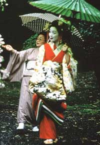 a full length photo of a geisha