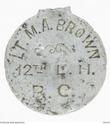 An officer's identity disc. Of interest is the lack of a service number. Officer's in the First World War were not allocated service numbers.
