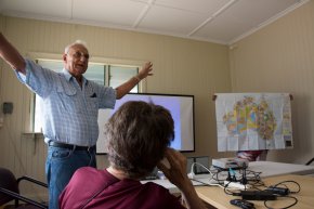Dr. Grant answers a question from our group. The Aboriginal map of Australia is held up for reference.