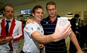 Dylan Hartley posed for pictures with fans on touching down in Brisbane