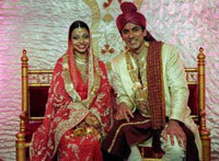 man and woman in traditional indian wedding outfits